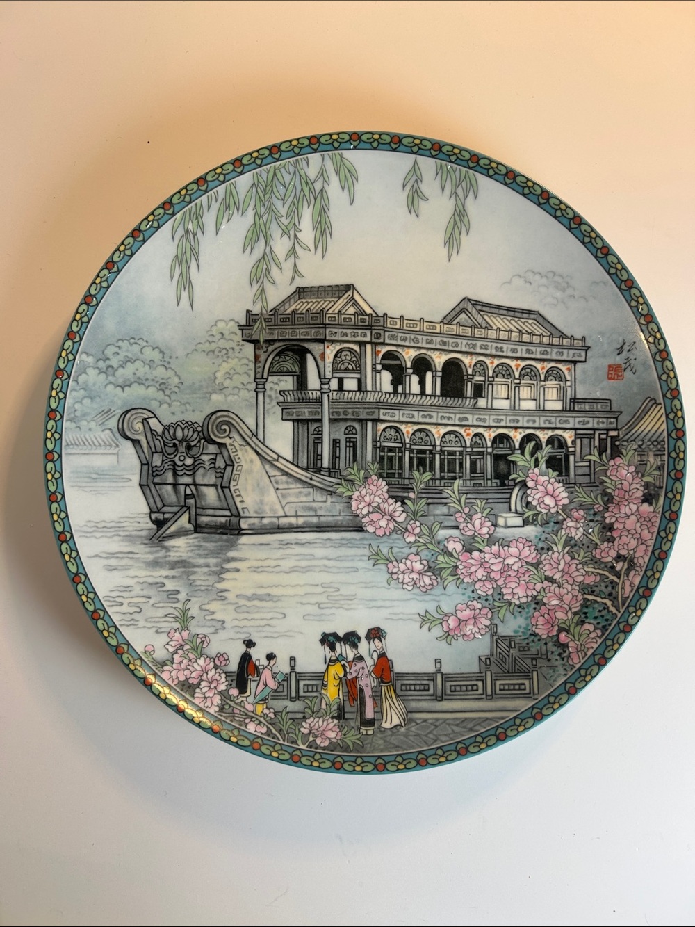 Hand-Painted Decorative Porcelain Plate with Floral Riverside Scene (1988)